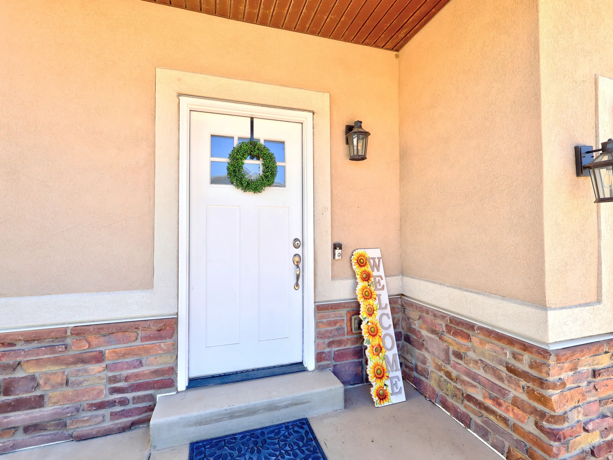 Stucco exterior with a stone veneer accent