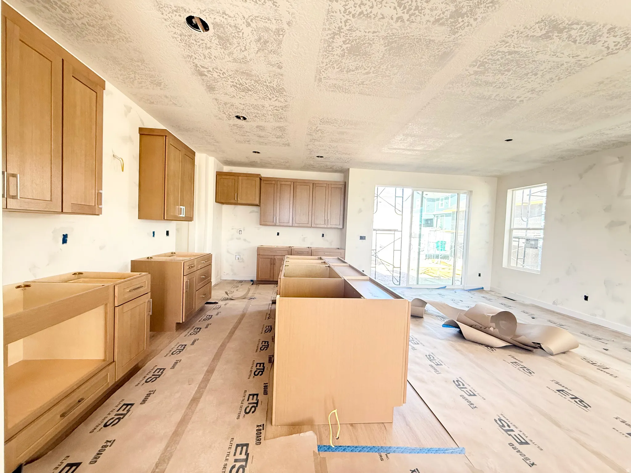 Wood-finish cabinetry and built-in island structure