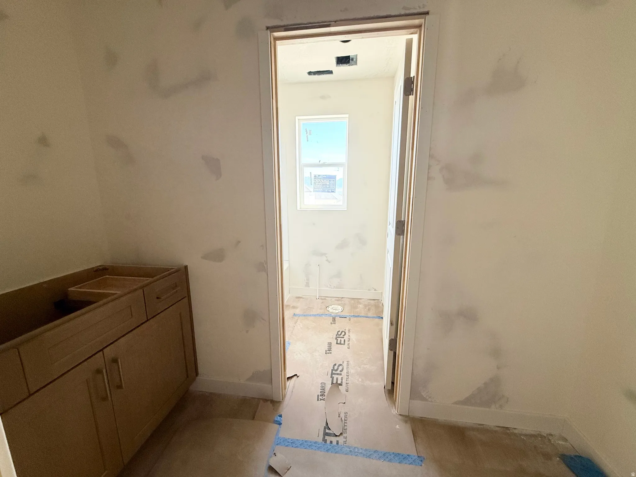 Unfinished wood cabinetry with dual doors, single drawer, and open top