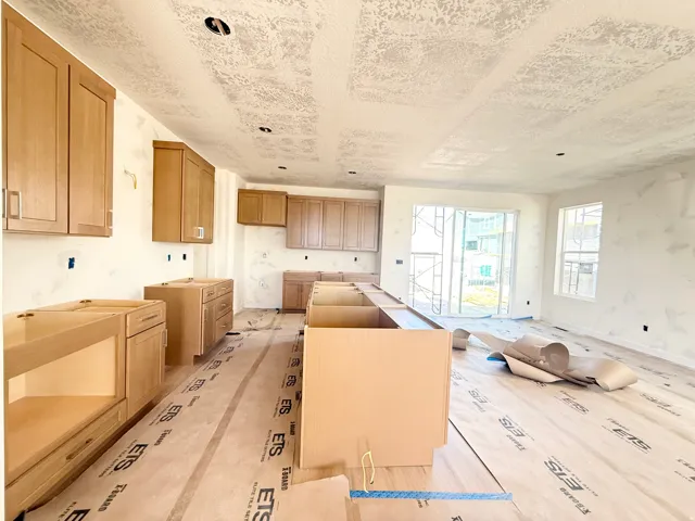 Wood-finish cabinetry and built-in island structure