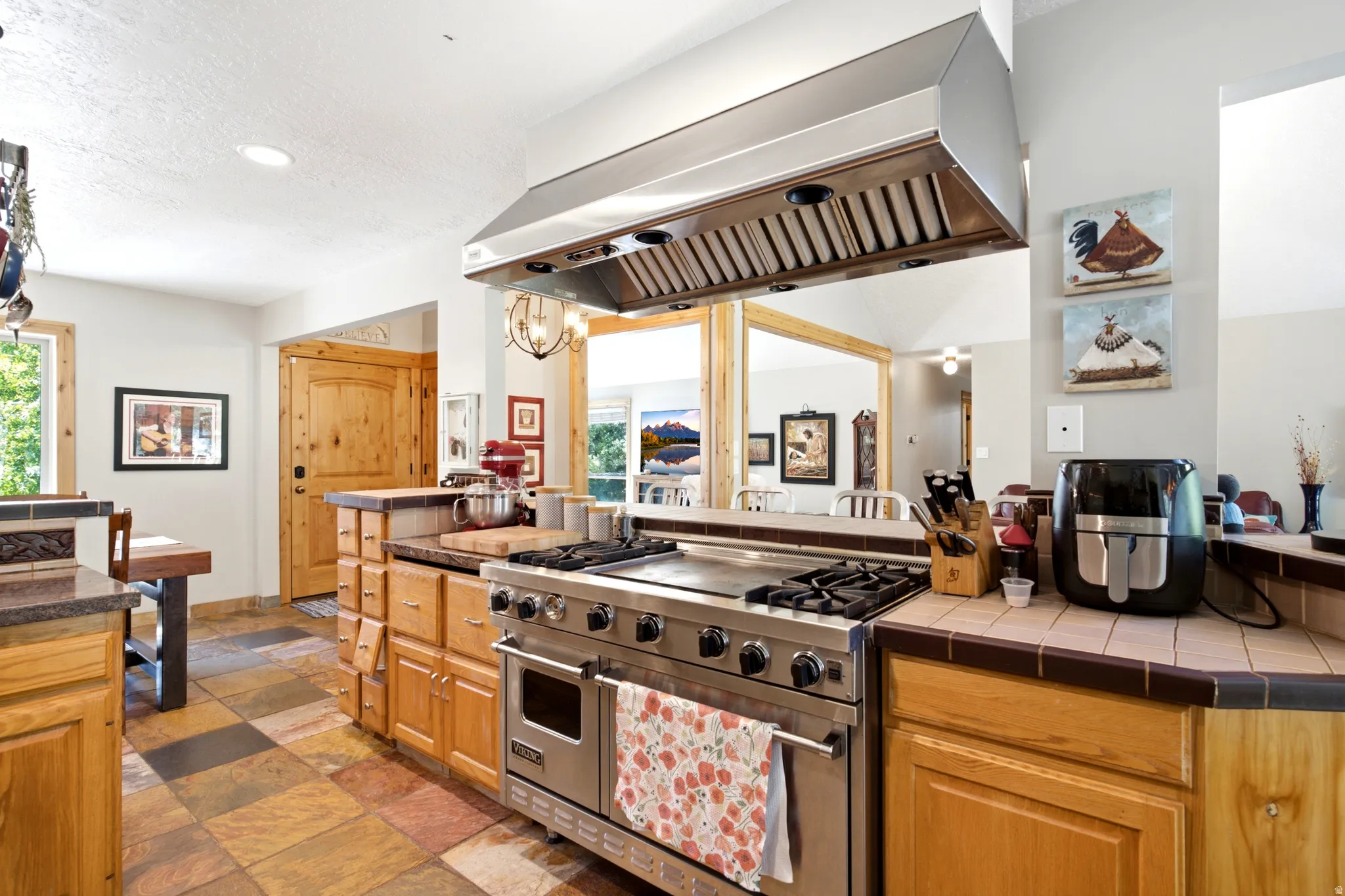 Stainless steel professional-grade range with a matching range hood