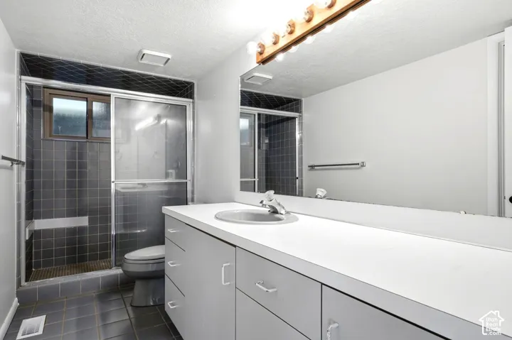 Extended vanity with integrated sink, full-width mirror, and cabinet storage