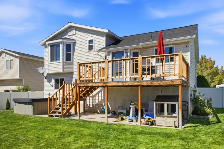 Exterior siding with bay window and a second-story wood deck