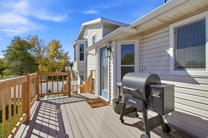 Outdoor deck with composite flooring and natural wood railings
