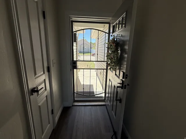 Dark wood-finish flooring with a white trim
