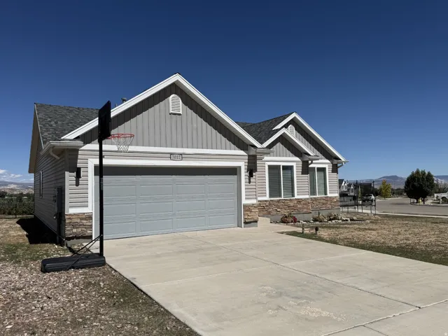Contemporary exterior featuring horizontal siding and stone accents