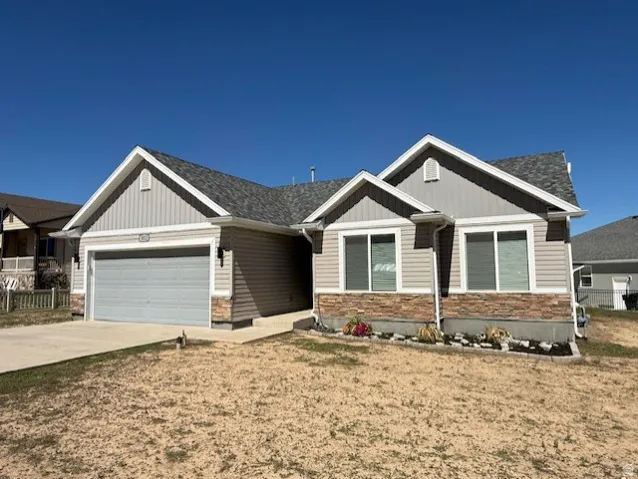 Grey shingle roof and light grey siding exterior with white trim