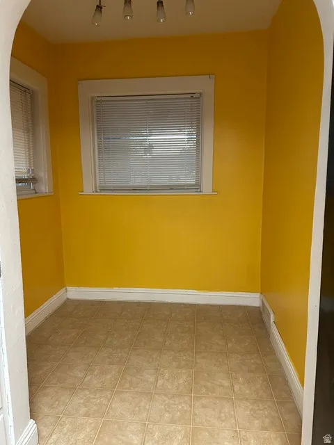 Kitchen breakfast nook. two windows with blinds, recessed lighting, and bright yellow walls