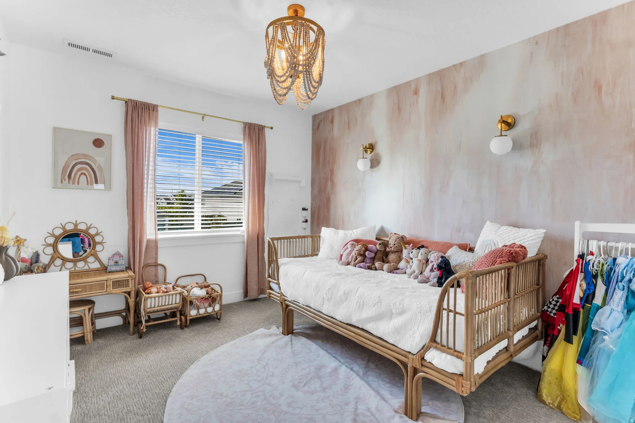 Recessed lighting, window with blinds, decorative wall treatment, two wall-mounted sconces, and a ceiling-mounted light fixture