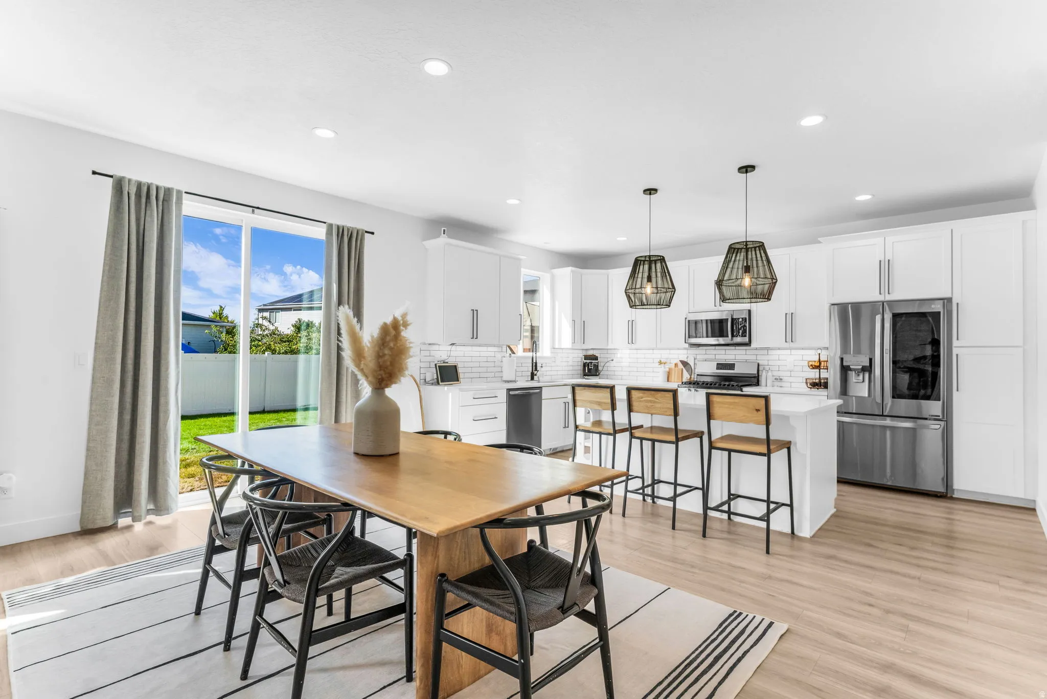Open-concept living space with wood-finish flooring