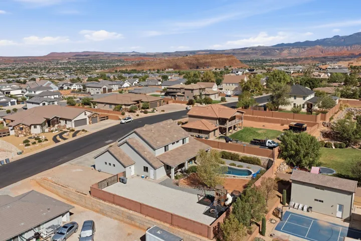 Expansive property featuring a swimming pool, sport court, and a detached structure