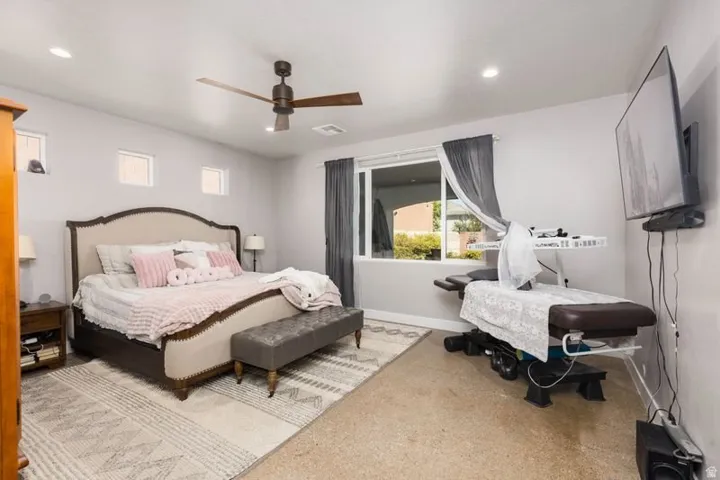 Recessed lighting, ceiling fan, and multiple windows provide ample illumination