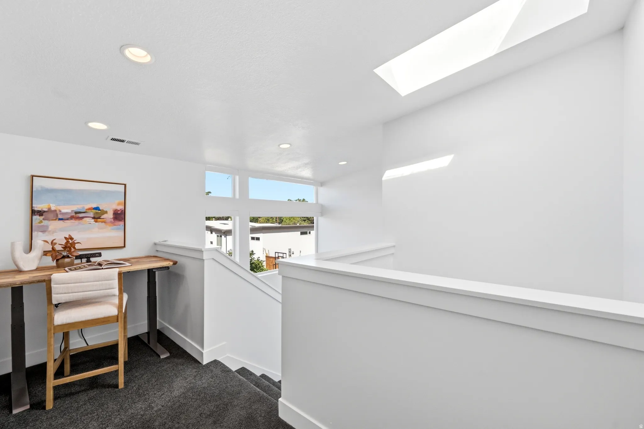 Top of Stairs nook.  Windows and skylight.