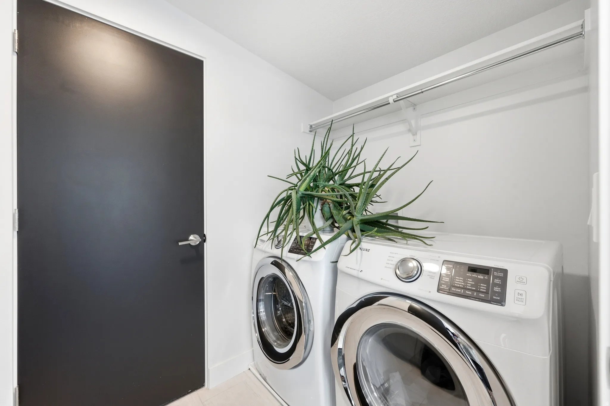 Second Floor laundry with storage cabinets