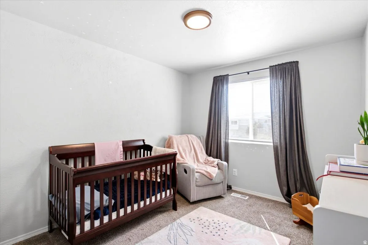 Recessed window with dark textile drapery