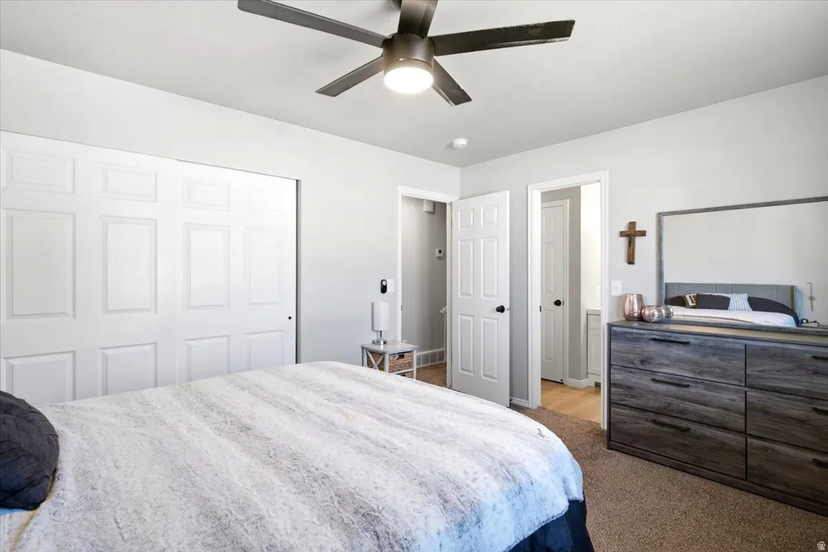 Recessed lighting, ceiling fan, white panel doors, and neutral wall tones