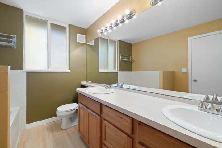 Dual vanity with integrated sinks and chrome fixtures