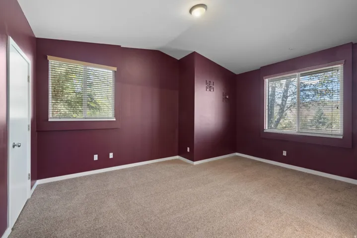 Recessed lighting and two windows with blinds
