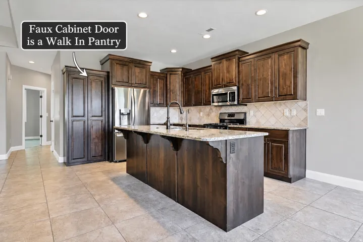 Spacious kitchen featuring wood cabinetry, granite countertops, stainless steel appliances, a tiled backsplash, and recessed lighting