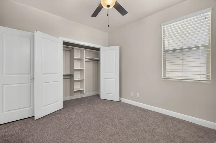 Wall-to-wall carpeting and neutral wall tones