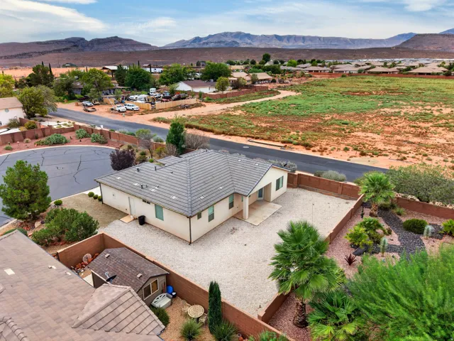 Single-story residence with a gray tile roof and stucco exterior