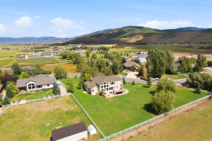 Expansive green lawn with mountain backdrop