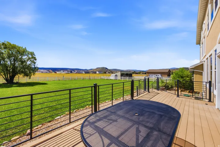 Expansive outdoor deck with composite decking and contemporary metal railings