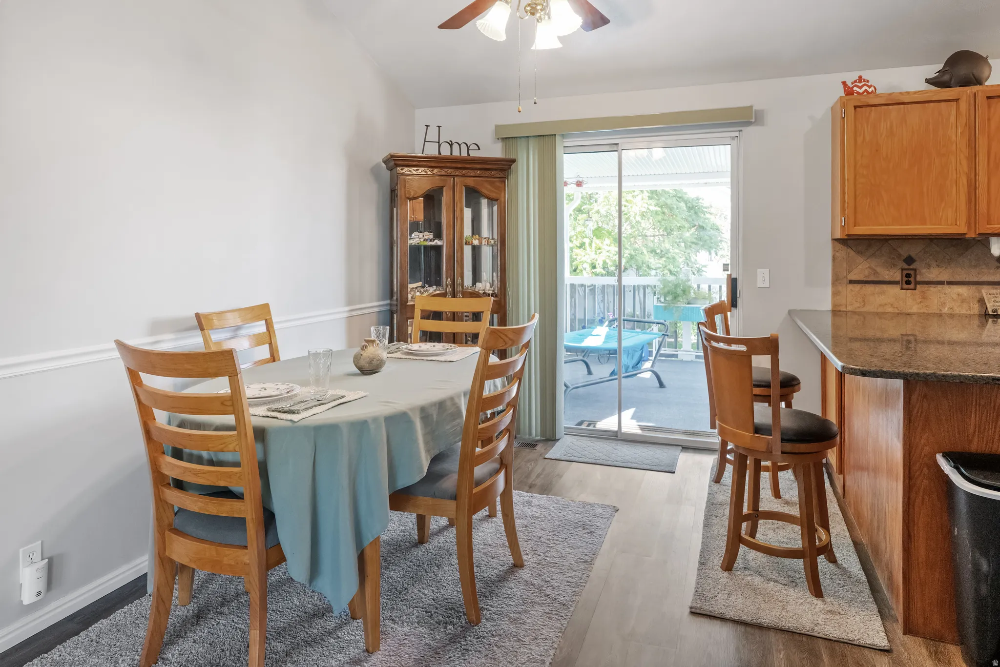 Semi formal dining with newer laminate flooring and opens to the large covered deck