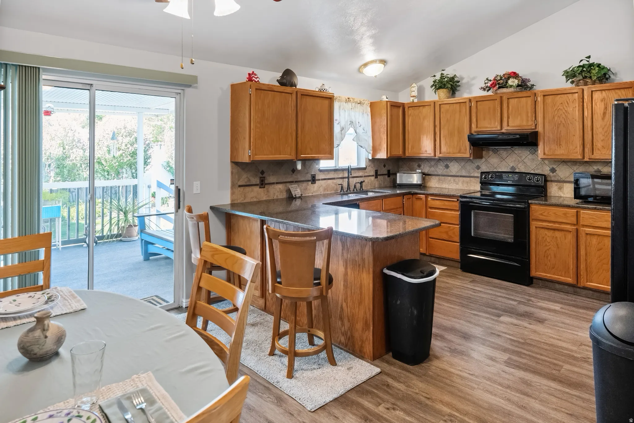 Beautiful kitchen with quartz countertops, tile backsplash. All appliances are included