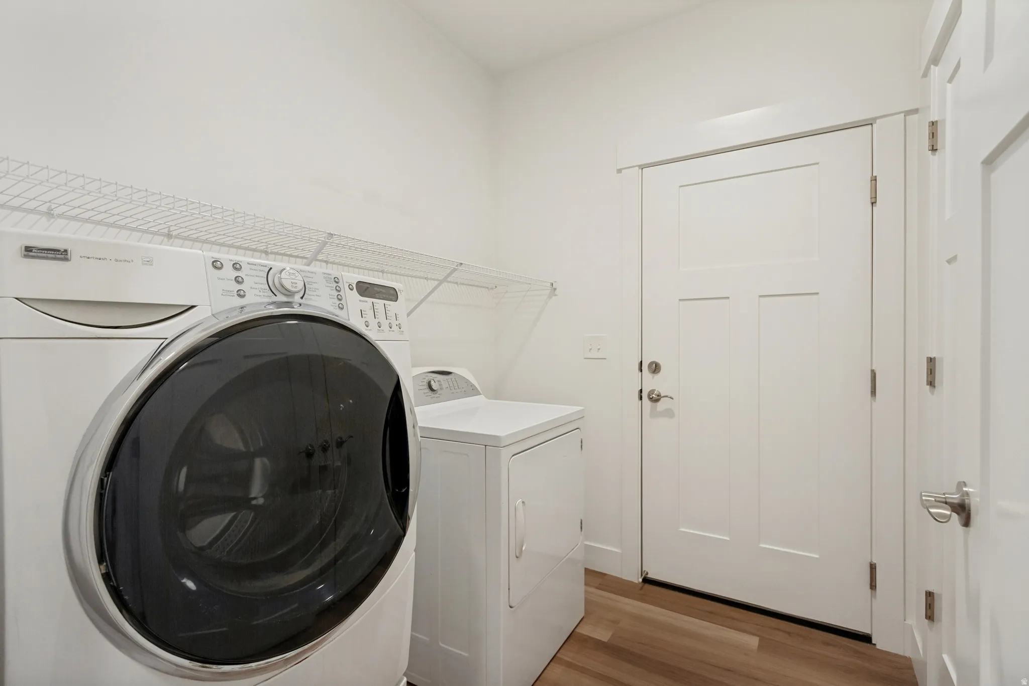 Dedicated laundry area with LVP flooring
