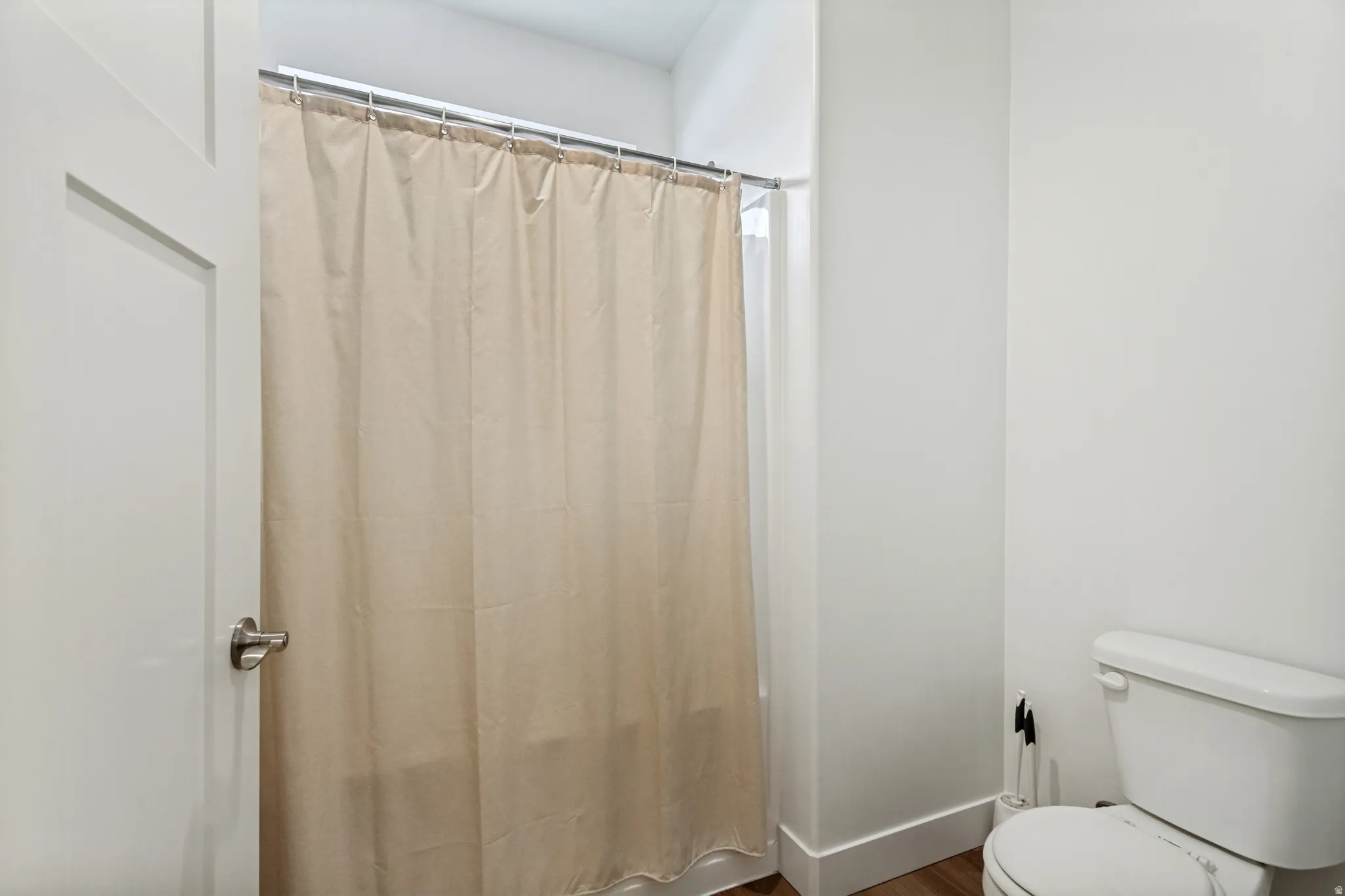 Primary bath featuring a separate tub and toilet area.