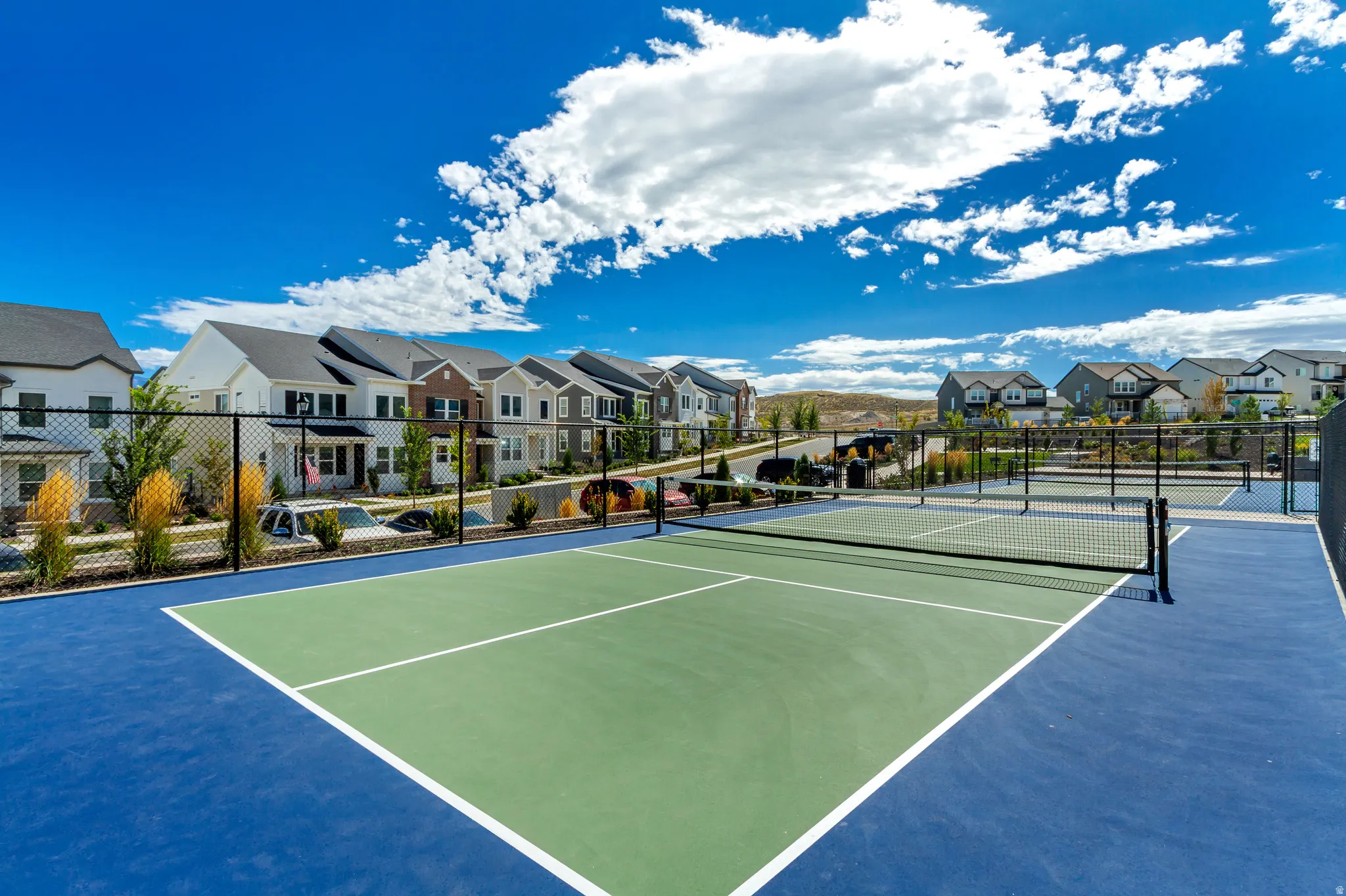 Outdoor sports court featuring blue and green surfacing