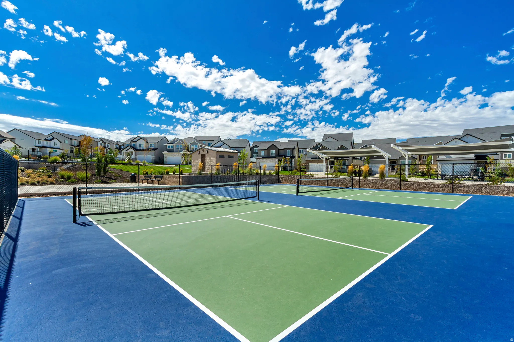 Dedicated multi-sport courts with blue and green surfacing