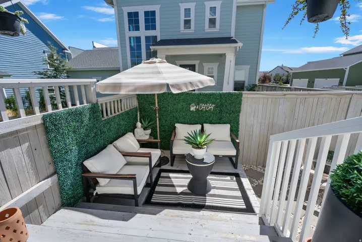 Wood-tone fencing enclosing an outdoor patio area