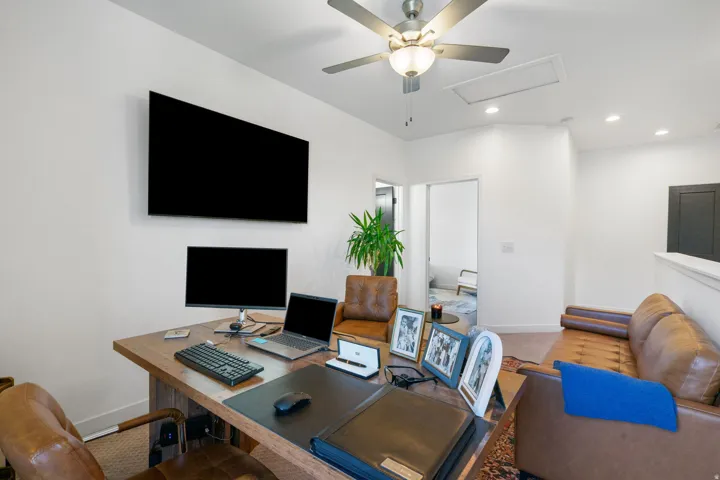 Vaulted ceilings featuring a ceiling fan, recessed lighting, and white walls