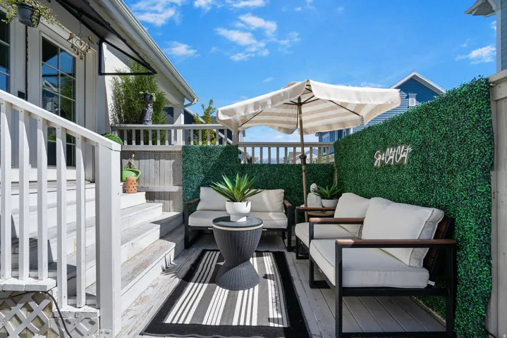 Wood deck with white painted railings and steps