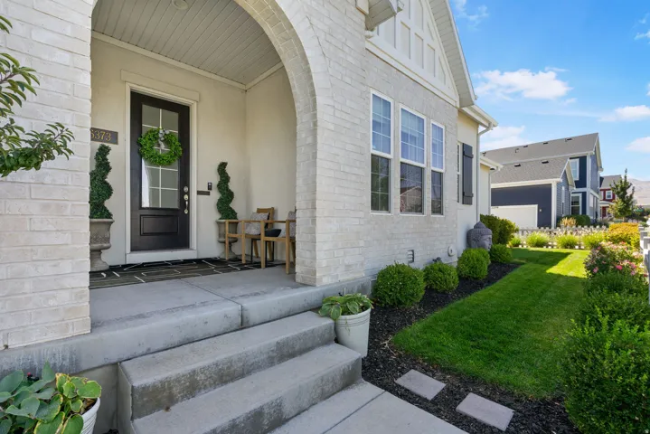 Arched entry portico with brick detailing