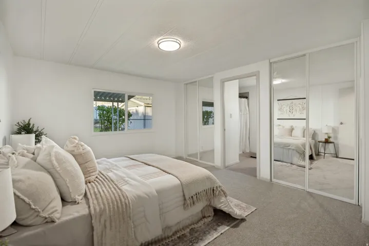 Primary bedroom with primary walk-in private bathroom and dual closets.