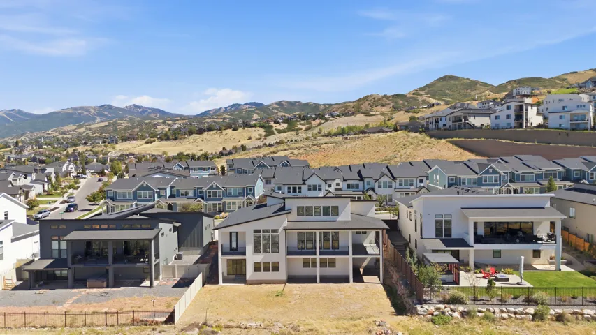 Contemporary architecture with multiple balconies and a flat roofline