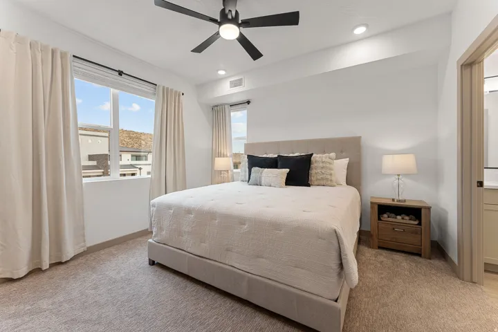 Recessed lighting, ceiling fan, and carpeted flooring