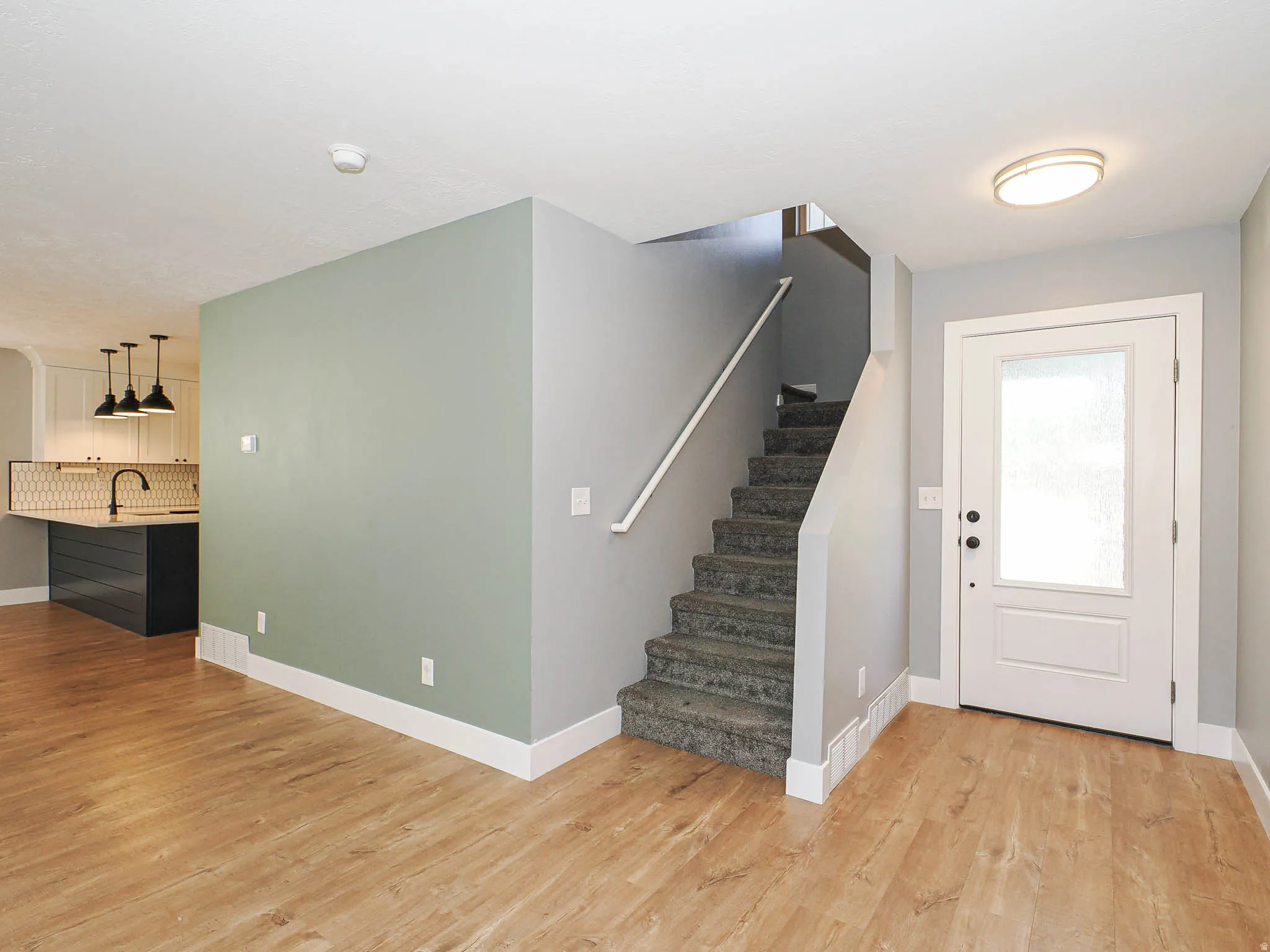 Wood-finish flooring throughout the main level
