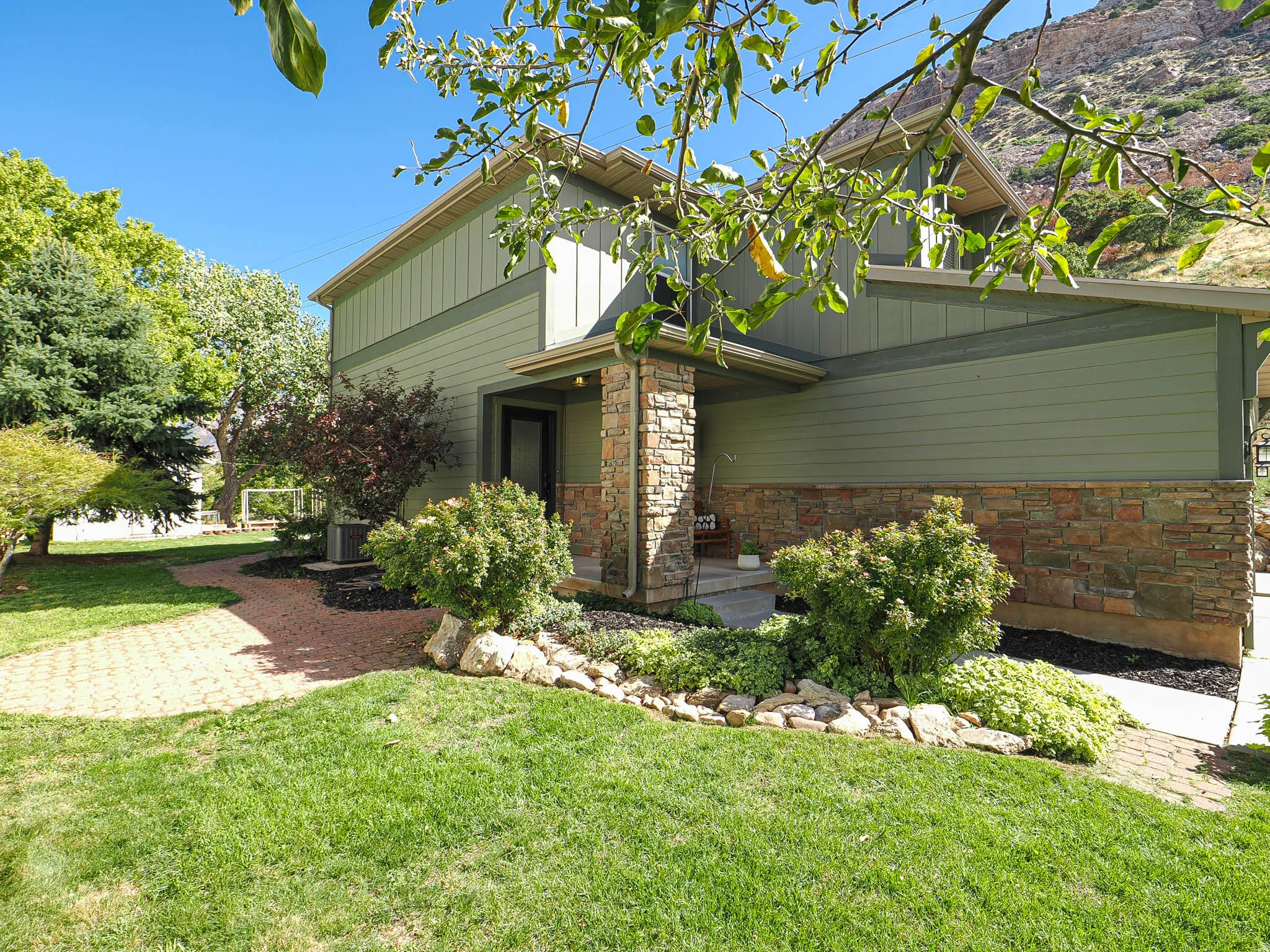 Two-story exterior with horizontal siding and vertical paneling