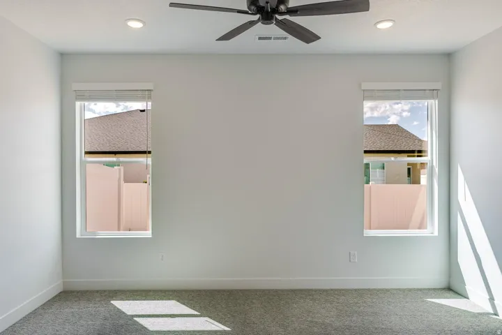 Recessed lighting, ceiling fan, and carpeted flooring