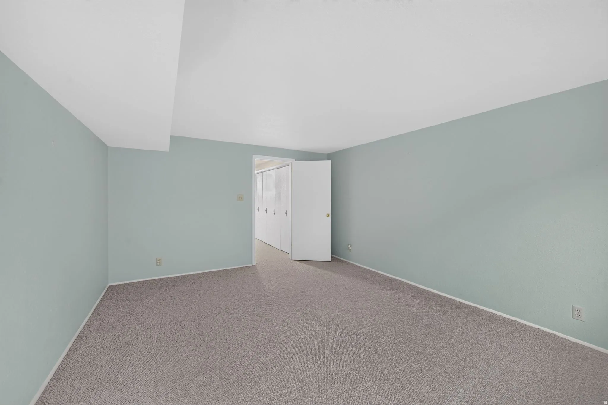 Wall-to-wall carpeting and neutral wall tones