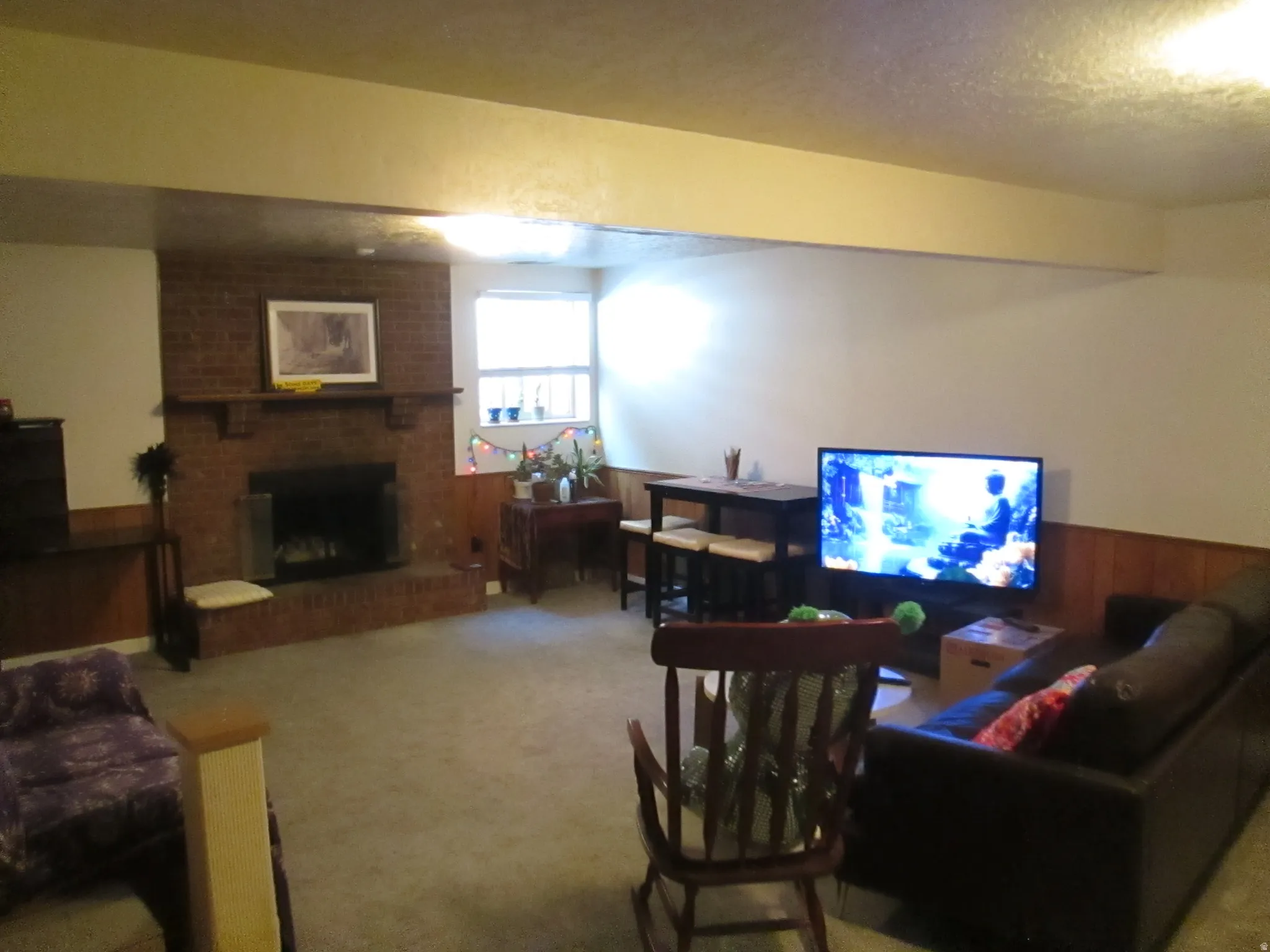 Brick fireplace with hearth and mantel