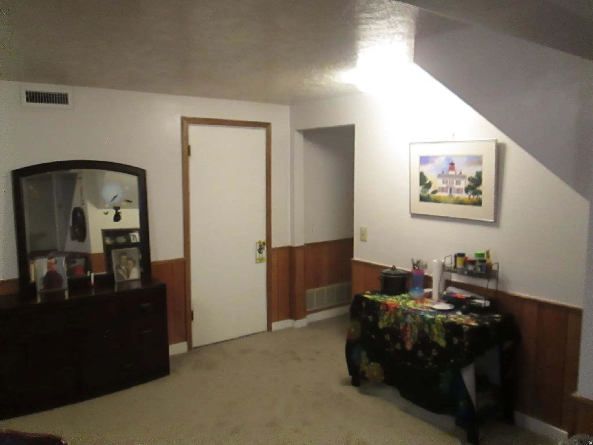 White walls featuring wood paneling