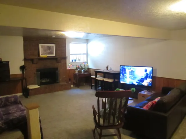 Brick fireplace with hearth and mantel
