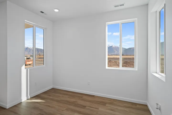 Recessed lighting and wood-finish flooring