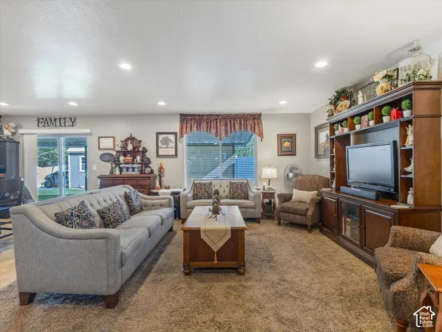 Recessed ceiling lighting, sliding glass door, and window with blinds