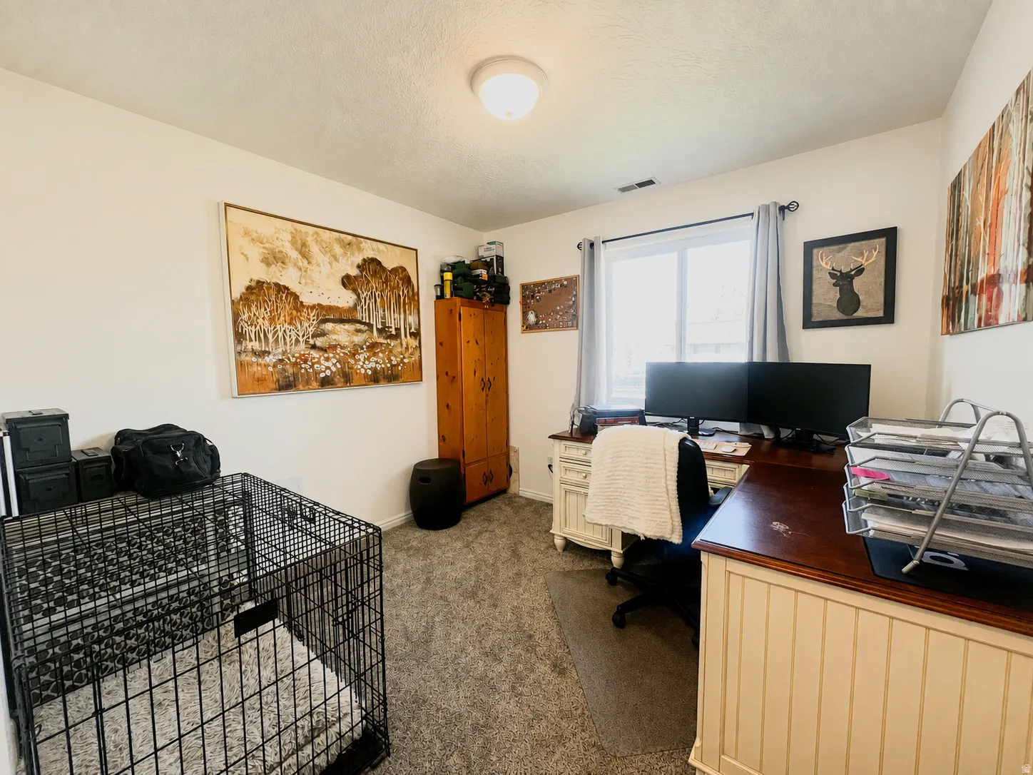 Recessed lighting, light-toned walls, and a window with blinds